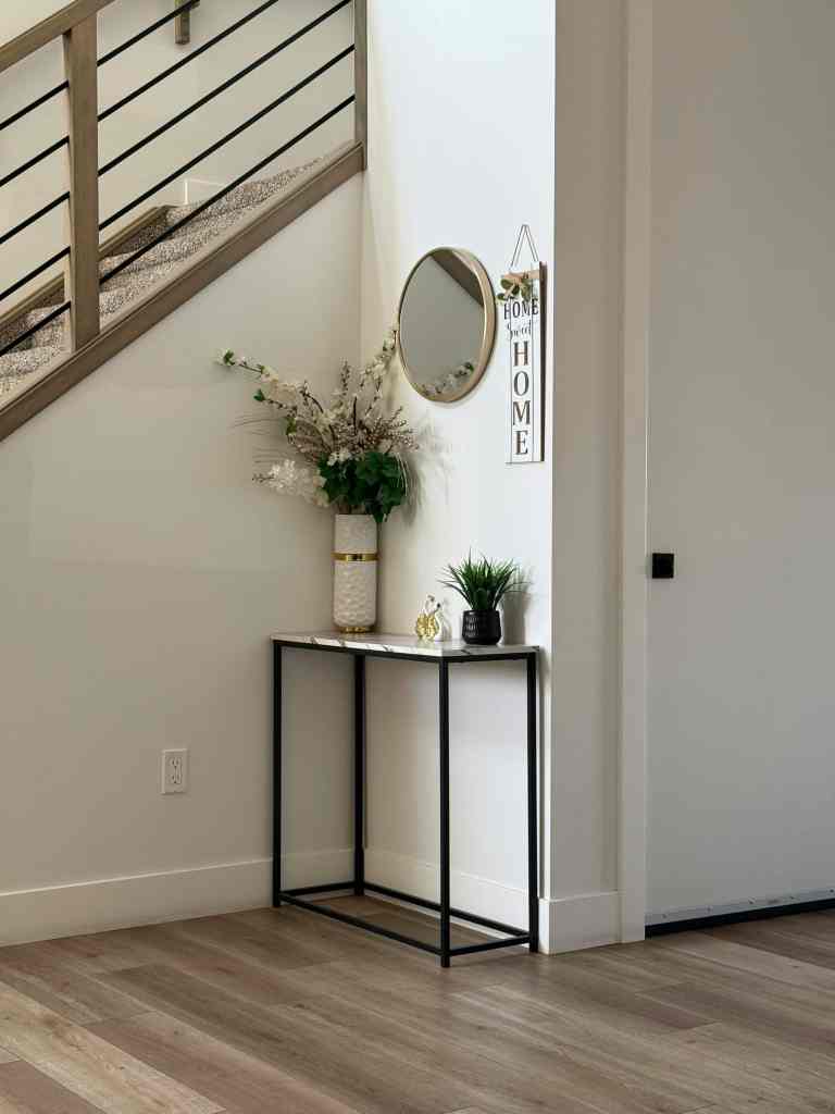 Narrow console table in a small apartment entryway